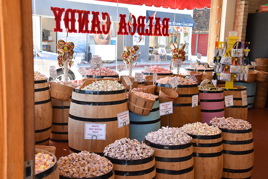  View Of the interior of the Balboa Candy Shop showing wooden barrels taffy and huge lolly pops near the front window 