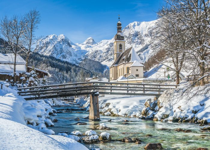 Panoramic view of scenic winter landscape in the Bavarian Alps with famous Parish Church of St. Sebastian in the village of Ramsau, Nationalpark Berchtesgadener Land, Upper Bavaria, Germany