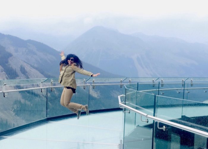 Woman jumping on the Jasper Skywalk