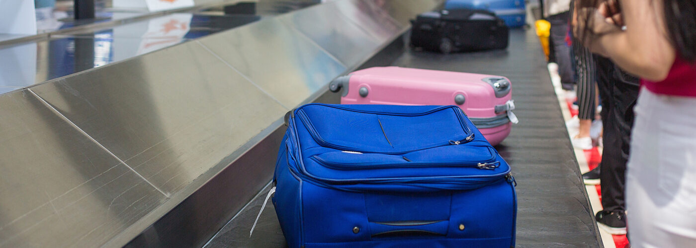 suitcases on baggage carousel.