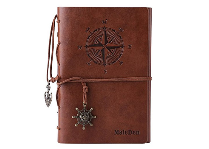 Leather bound journal with compass design on the cover