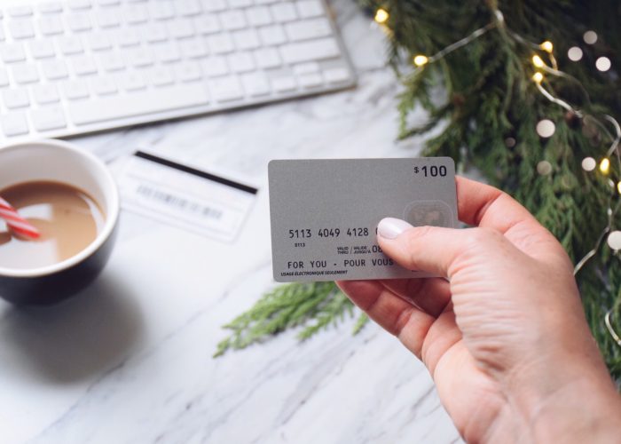 holiday-shopping-woman-s-hand-holding-a-credit-card-to-shop-online