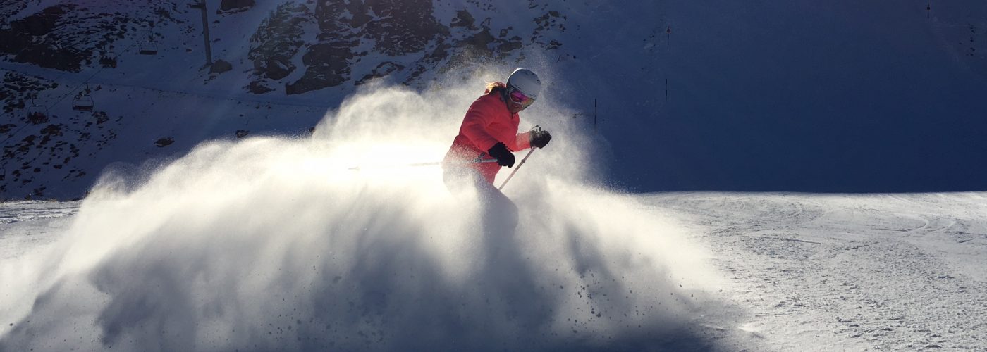 skier creating snow cloud