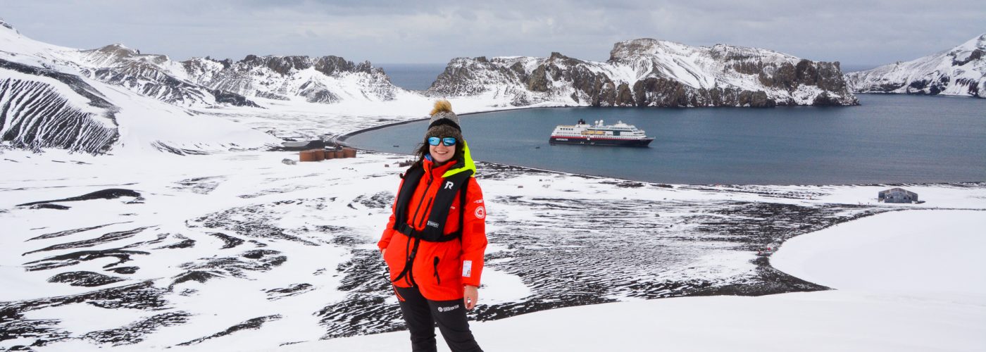 Woman Standing on Deception Island in Antarctica