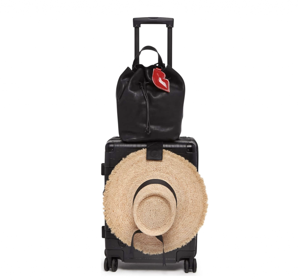 hat carrier on suitcase