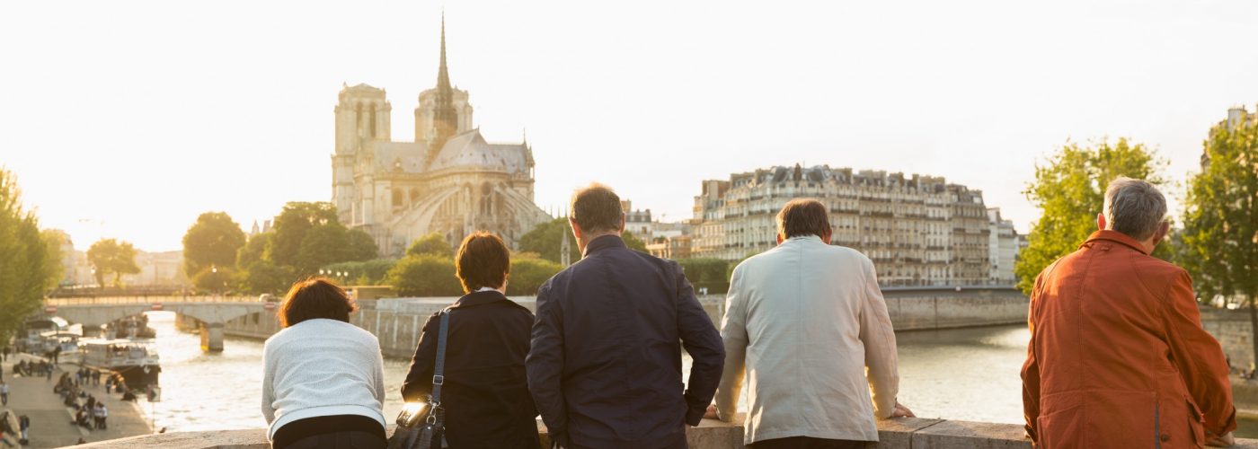 france-paris-friends-tourists-traveling-seniors-retired-notre-dame-retirement-tour-group
