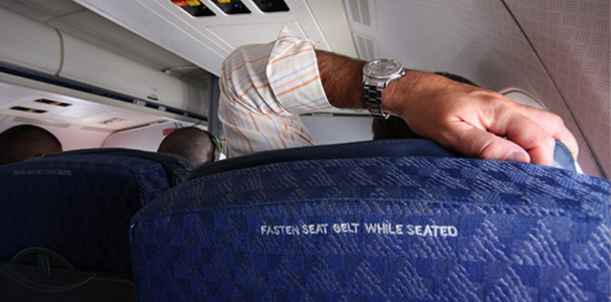 man reclining on airplane