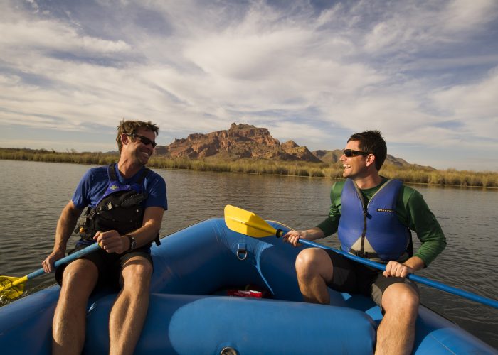 two men white water rafting
