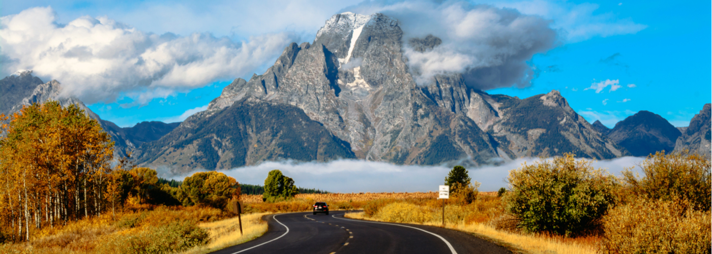 grand teton national park road with mountain background