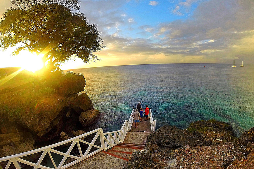 fishermen on a dock in tobago