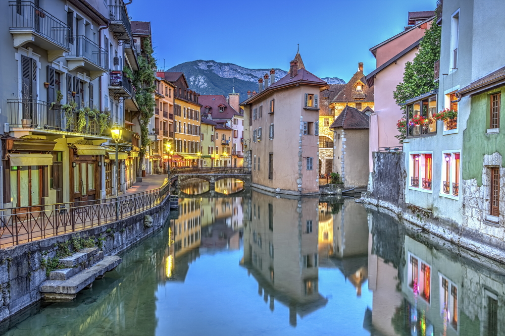 canals winding through buildings in european village.