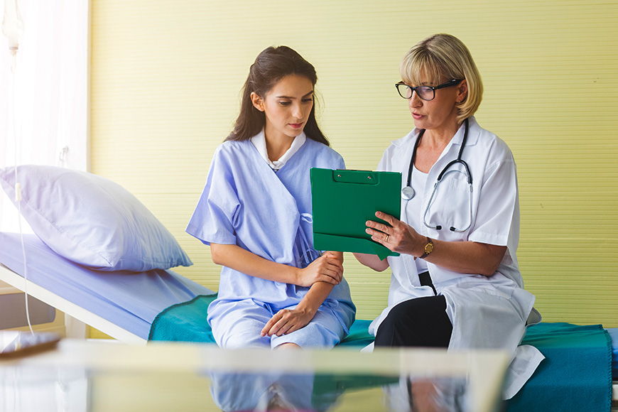 doctor patient exam discussing results 