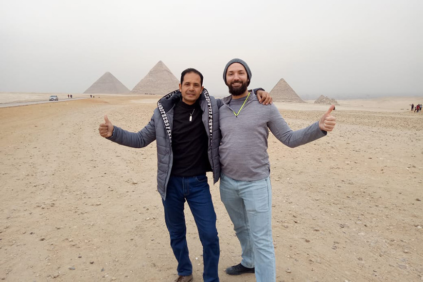 Egypt Best Holidays tour guides posing for photo in front of pyramids