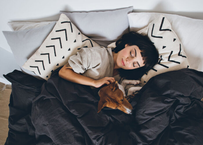 woman and dog in bed.