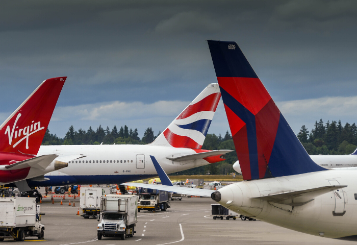 multiple airline tails on aircraft at seattle airport (delta, lufthansa, virgin, british)