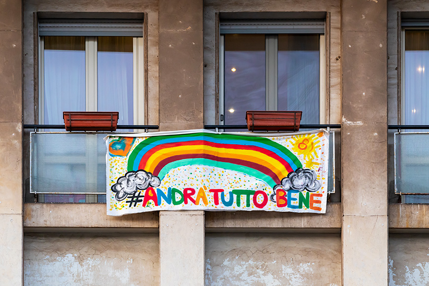 Italians locked up in the quarantined house display the rainbow flag with the words "everything will be fine".
