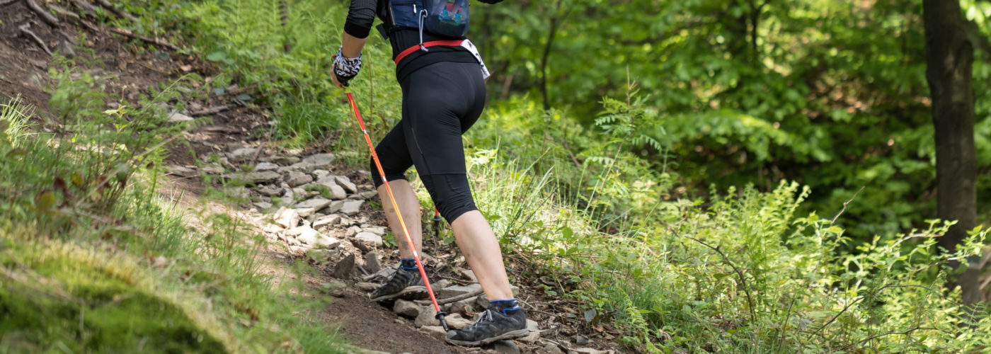 Woman hiking in woods wearing leggings