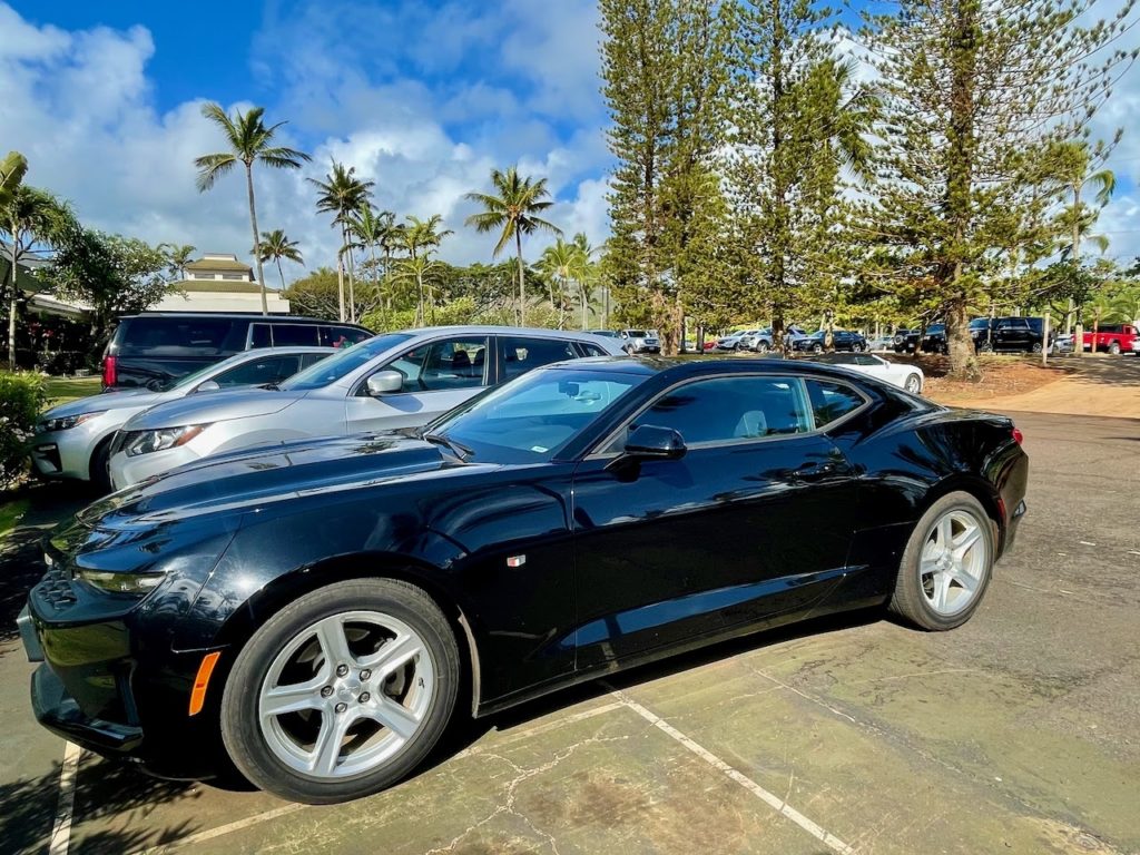 Sports car in a rental car lot