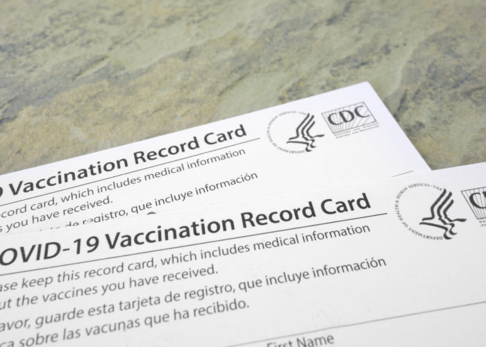 Two COVID-19 vaccination cards