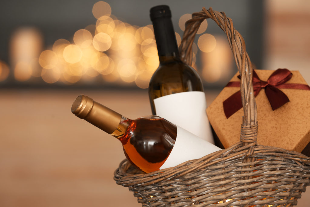 Gift basket with two wine bottles and cork coasters