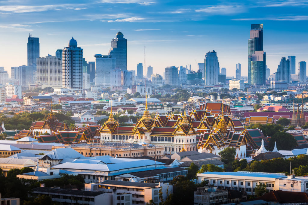 Grand Palace of Bangkok, Thailand with city skyline in the background