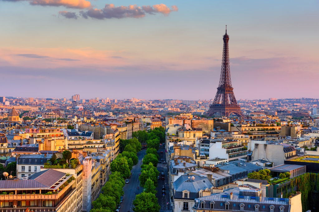 Aerial view of Paris with Eiffel Tower featuring prominently in the skyline