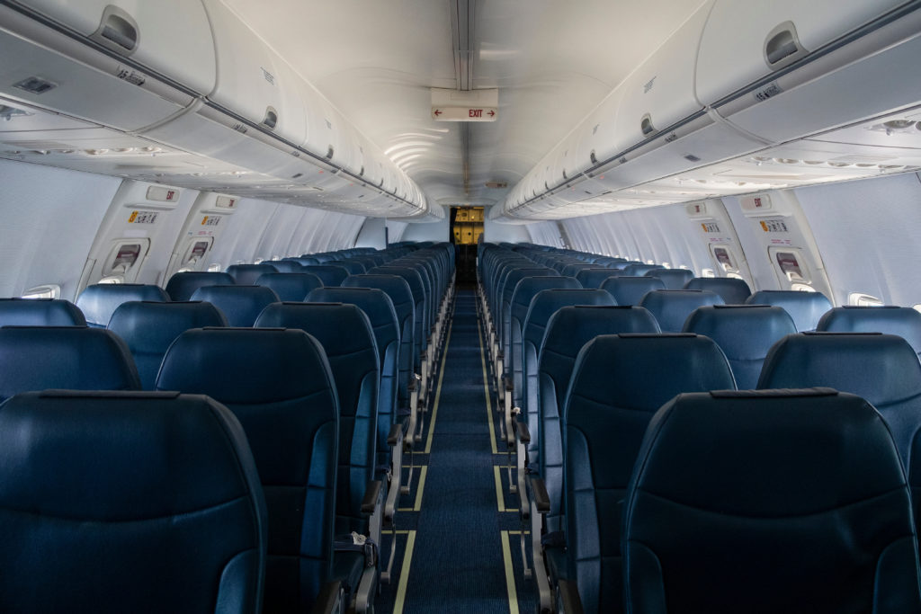 View of an empty airplane down the central aisle