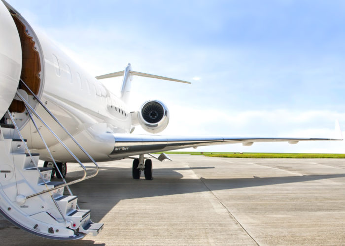 Exterior of a private jet with stairs lowered at the entrance