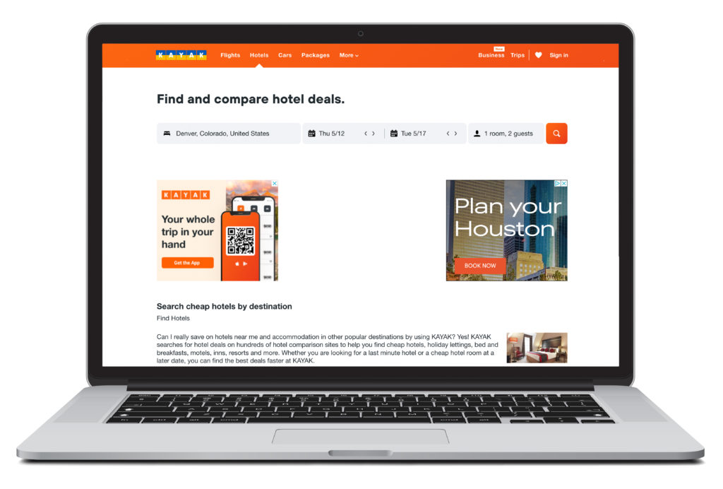 Open laptop showing home screen of Kayak, one of several listed accommodation booking sites