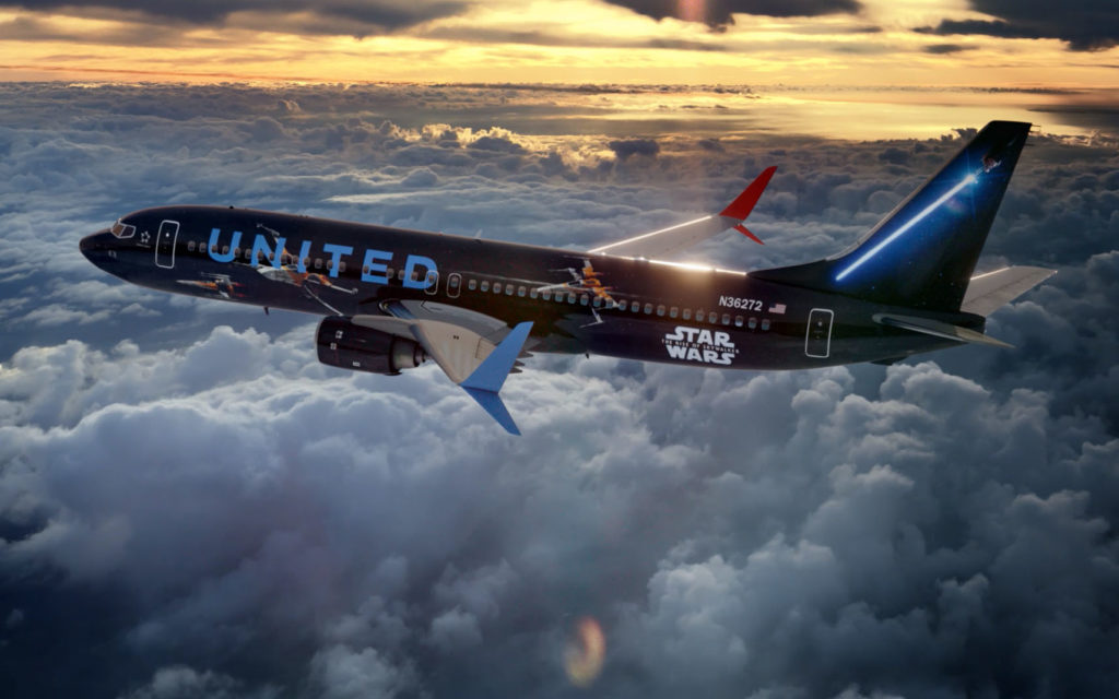 The Rise of Skywalker jet from United Airlines flying through clouds at sunset