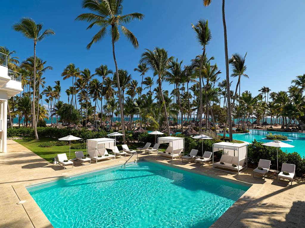 Pool surrounded by palm trees at The Level at Melia Punta Cana Beach Adults-Only All-Inclusive, Punta Cana Dominican Republic