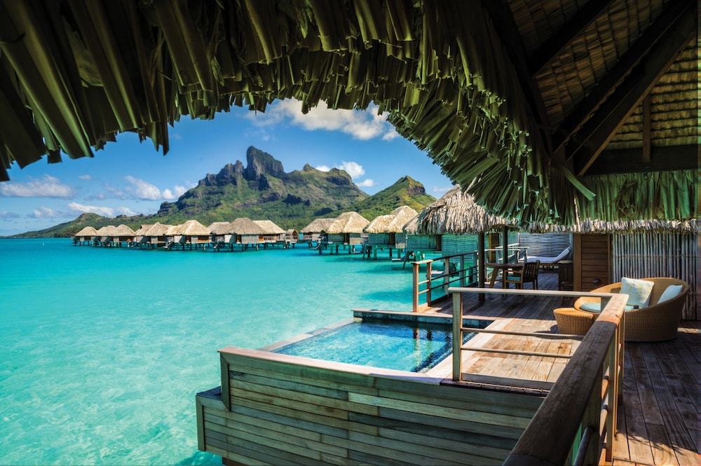 View of overwater bungalows from a bungalow deck at the Four Seasons Resort Bora Bora