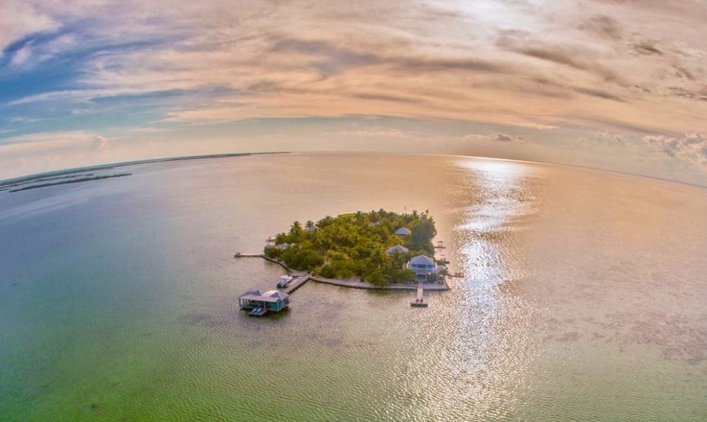 Aerial view of private island and bungalow at Cayo Espanto, Ambergris Caye, Belize