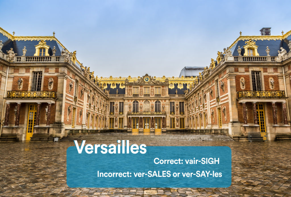 Front plaza at the Palace of Versailles in Versailles, France with graphic overlay showing the correct and incorrect way to pronounce "Versailles"