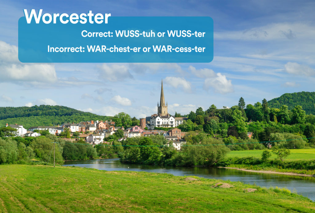 Green field with city of Worcester, England in the background with graphic overlay showing the correct and incorrect way to pronounce "Worcester"