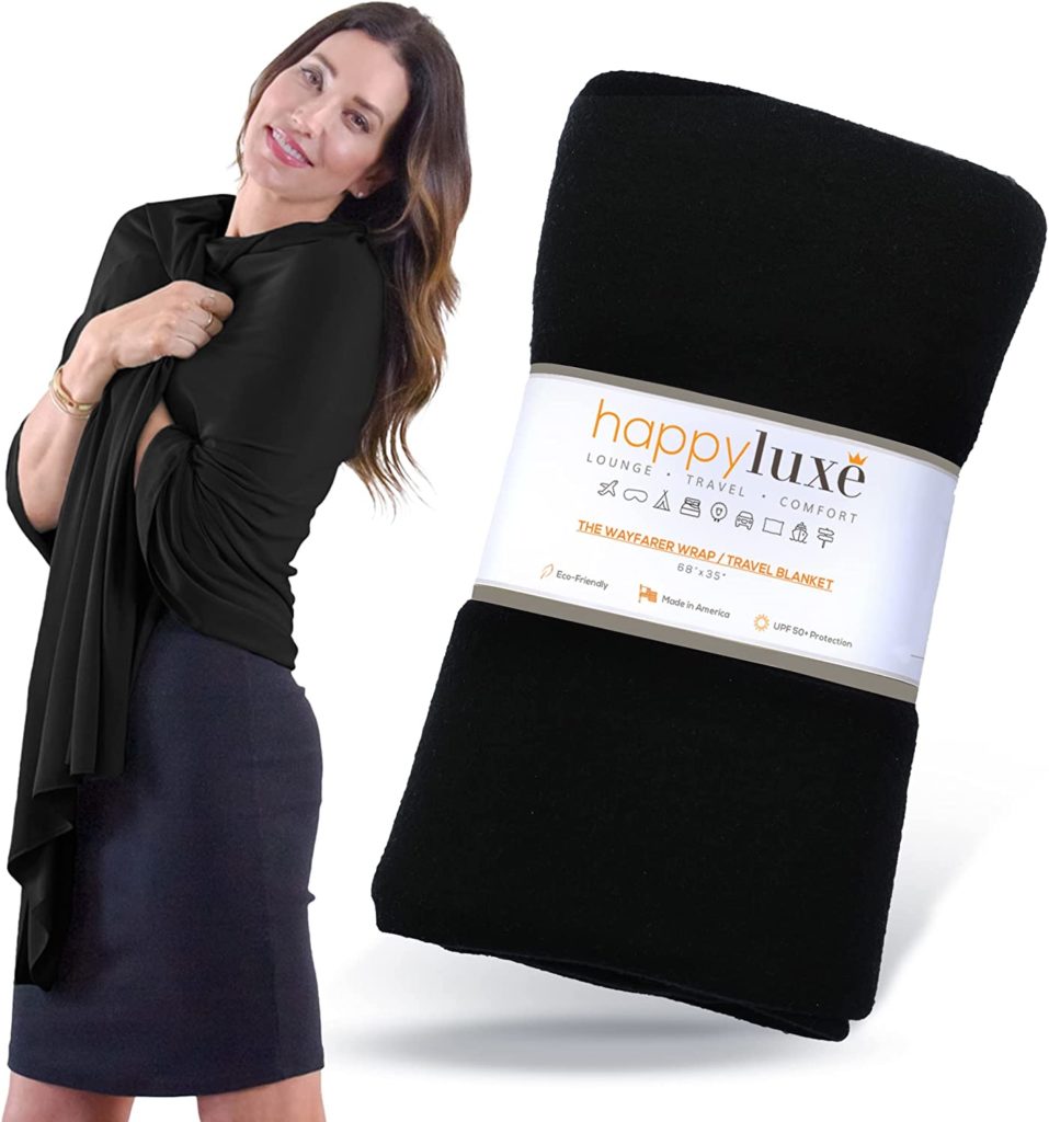 Woman wearing the HappyLuxe shawl over a black dress next to an enlarged image of the packaging of the HappyLuxe shawl