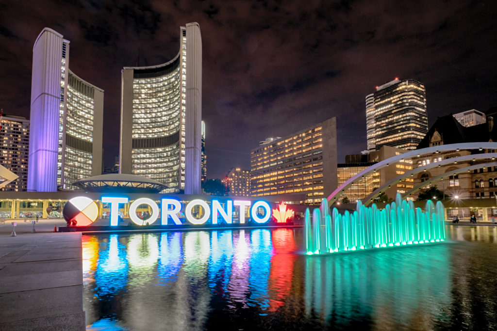 Lit up Toronto sign at Nathan Phillips Square in Toronto, Canada at night