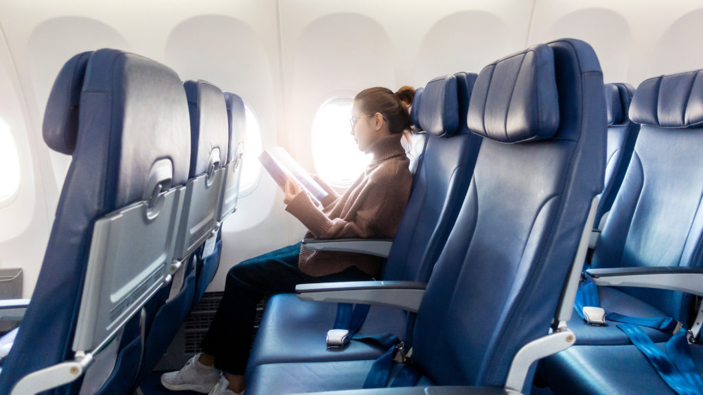Woman reading on plane