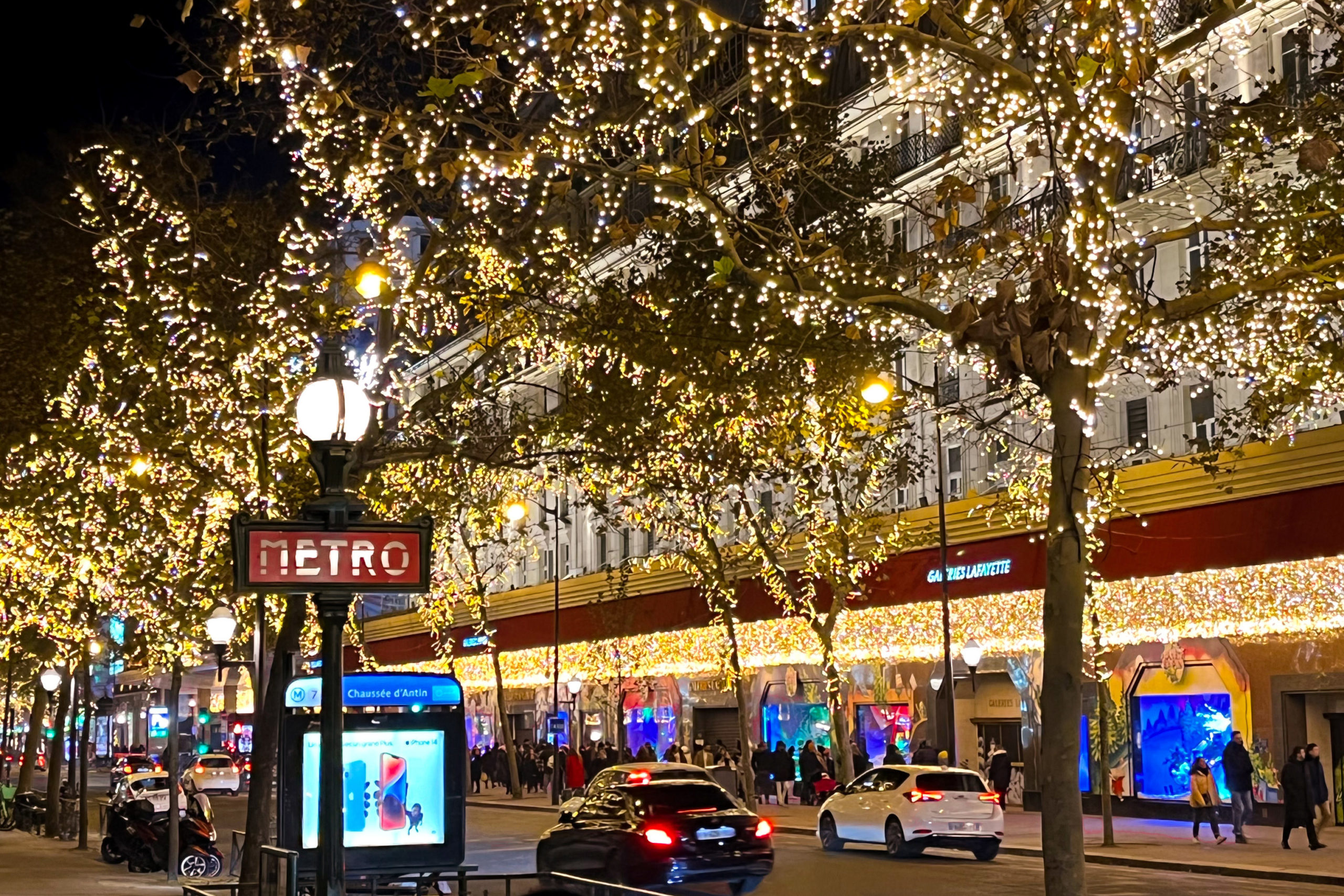 Street lined with holiday lights in Paris, France