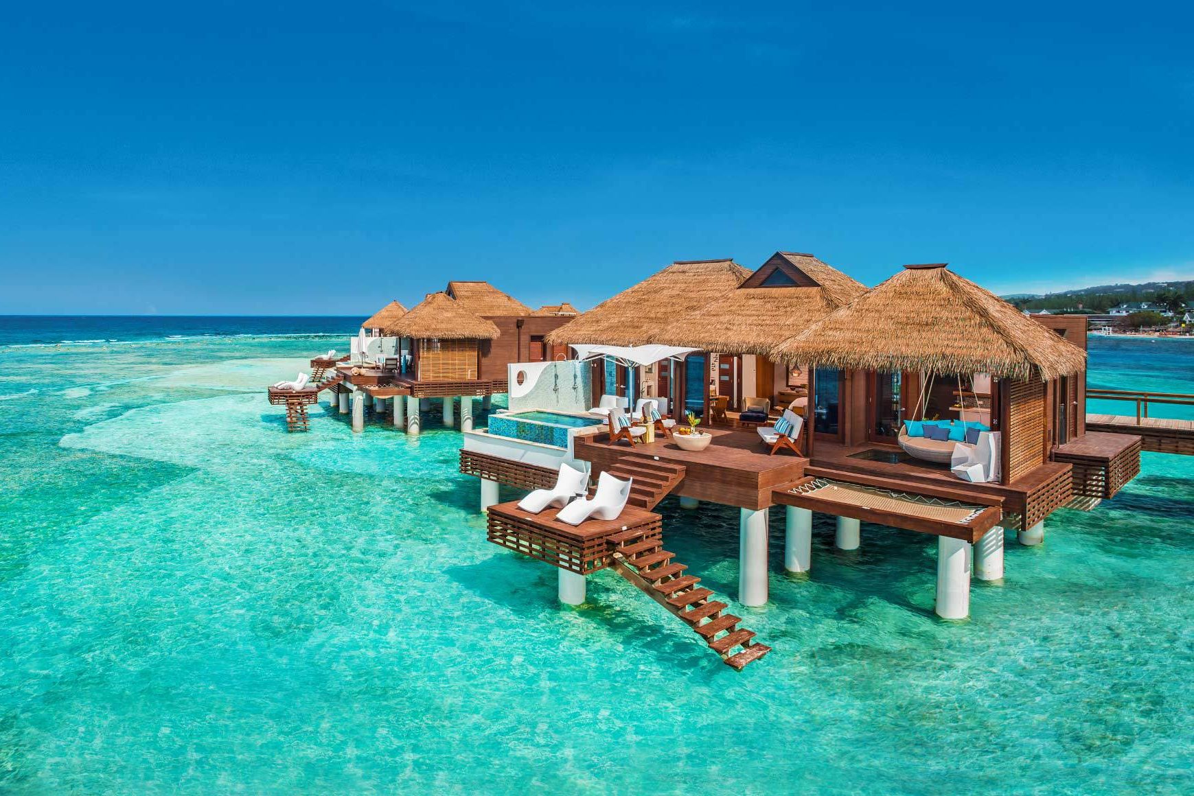 Row of overwater bungalows at Sandals Royal Caribbean, Jamaica
