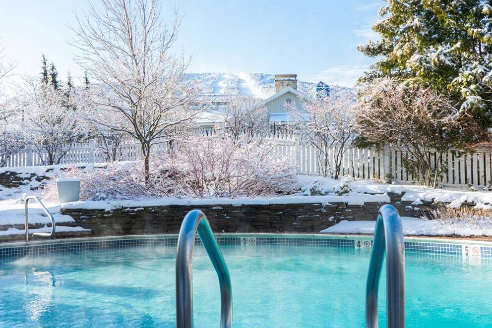 Heated pool at Long Trail House overlooking a winter landscape