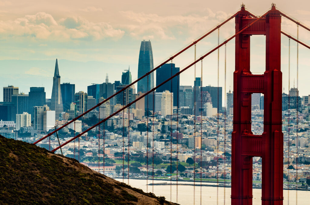 San Francisco as seen through a tower of the Golden Gate Bridge