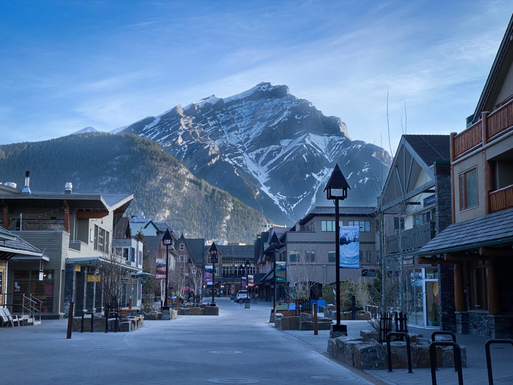 Downtown Banff with mountains in the background on a clear day