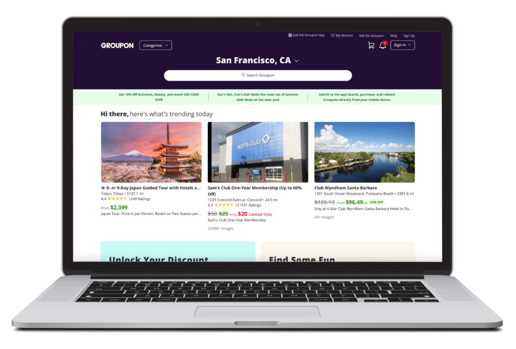 Laptop showing the homescreen of Groupon, a ticket and excursion booking website