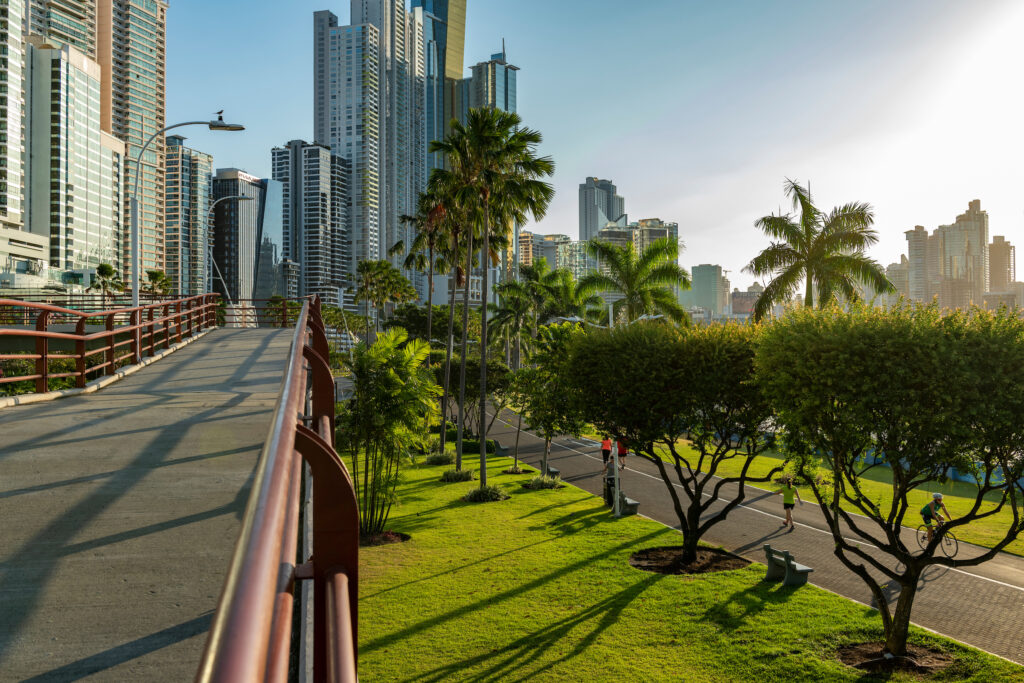 Walking path leading toward the skyline of Panama City in the distance