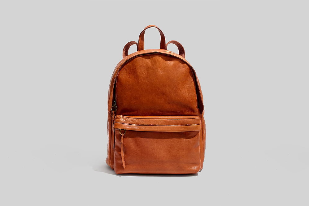 Best Leather Backpack for Travel - Madewell The Lorimer Backpack on grey background