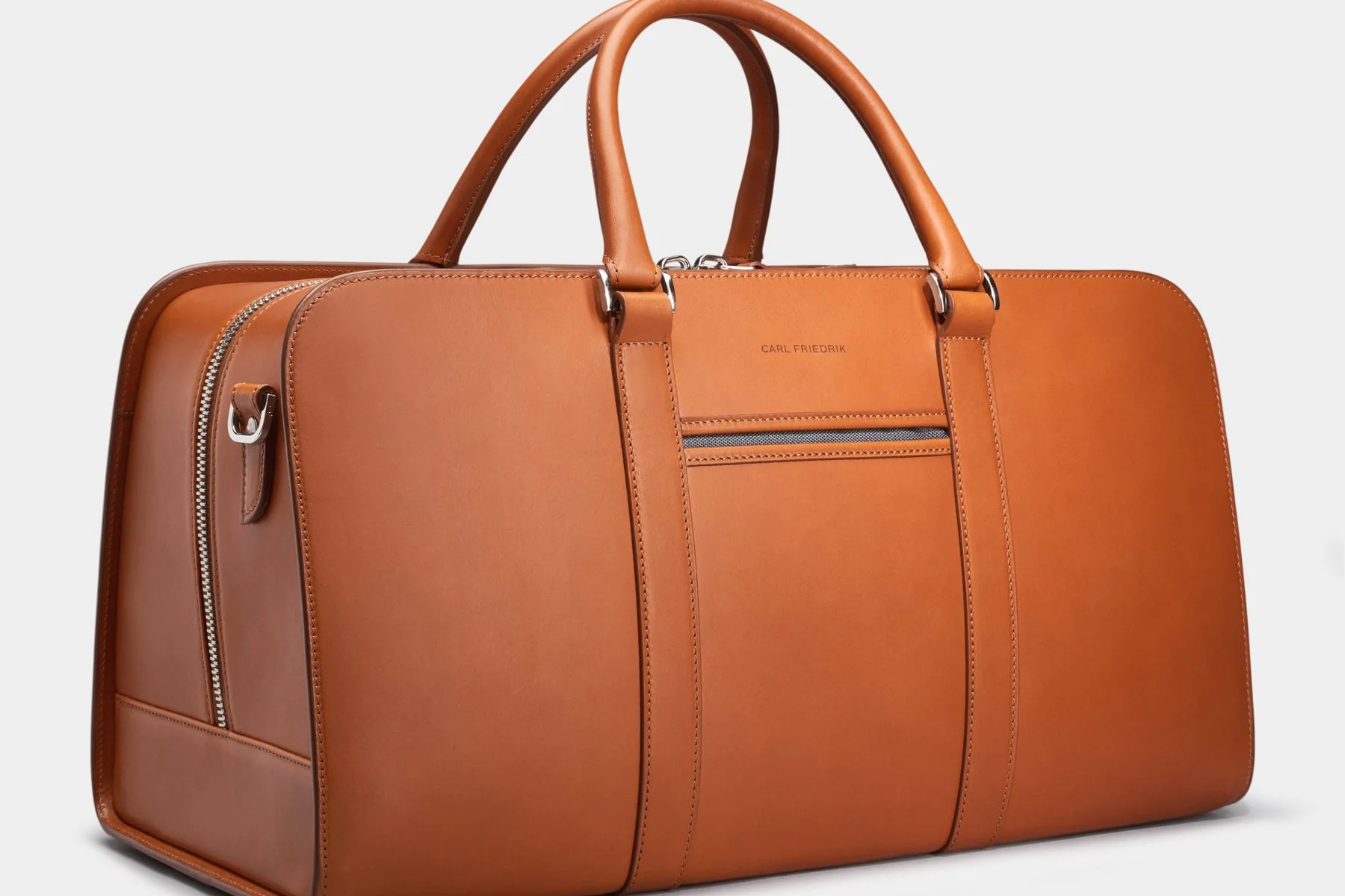 Cognac colored leather weekend bag called the Palissy