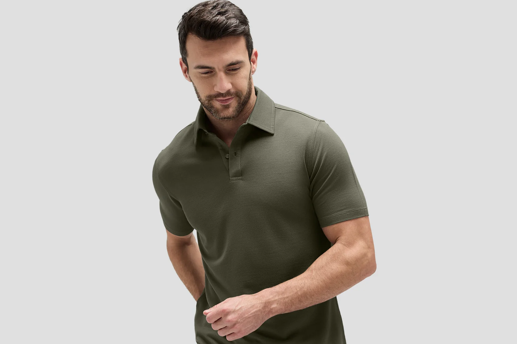 Male model in forest green polo shirt