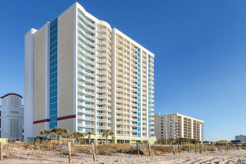 Angled view of the Club Wyndham Towers on the Grove looking up and to the right from the beach