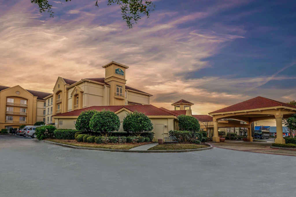 Front entrance of the La Quinta Inn & Suites by Wyndham Myrtle Beach Broadway Area during sunset